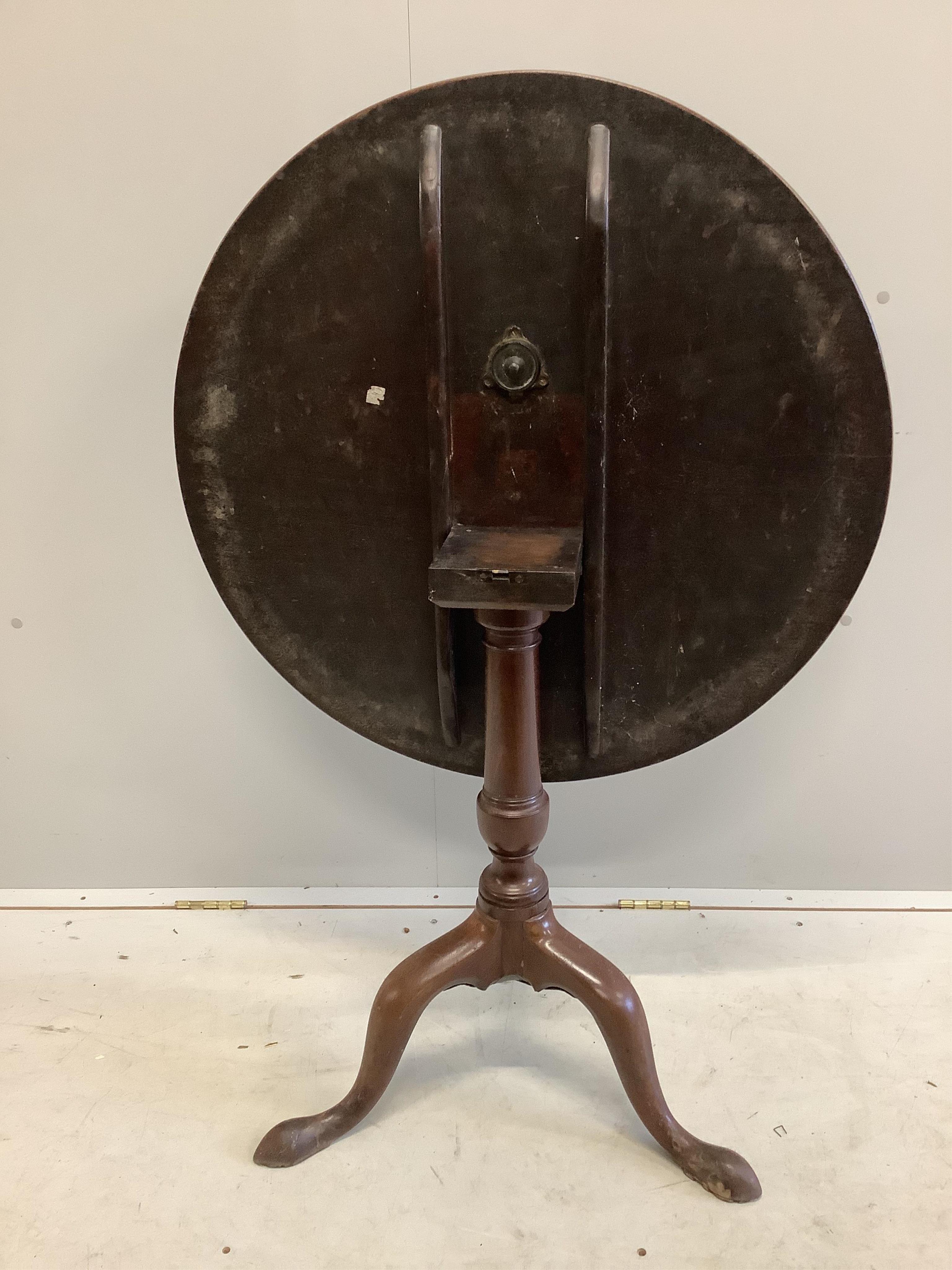 A George III circular mahogany tilt top tea table, diameter 78cm, height 71cm. Condition - fair